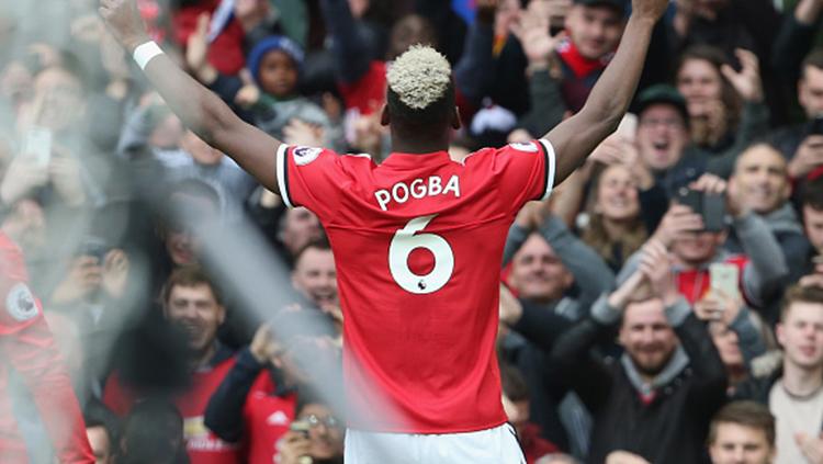 Paul Pogba berselebrasi setelah mencetak gol pembuka bagi Man United saat melawan Arsenal.
