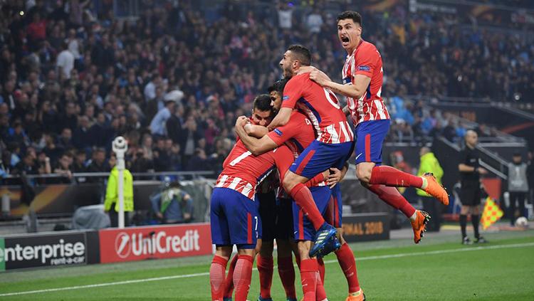 Para pemain Atletico Madrid merayakan gol yang diciptakan Griezmann ke gawang Marseille. - INDOSPORT