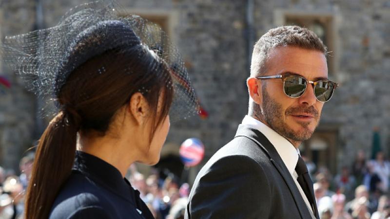 David Beckham tampil dengan kacamata hitam di pernikahan Pangeran Harry. - INDOSPORT