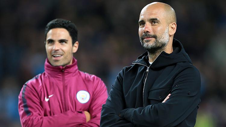 Pelatih Man City, Pep Guardiola dan asistennya, Mikel Arteta. Copyright: Getty Image