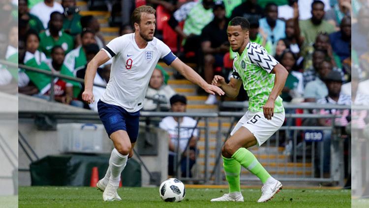 Harry Kane (kiri), William Troost Ekong (kanan) Copyright: Getty Images