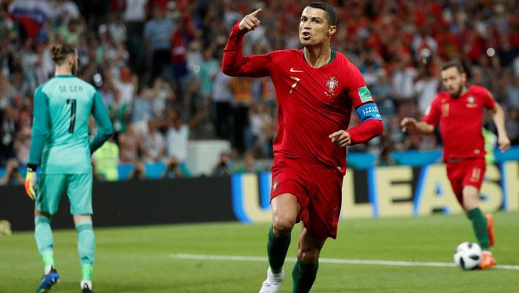 Selebrasi Cristiano Ronaldo saat berhasil membobol gawang Spanyol. - INDOSPORT