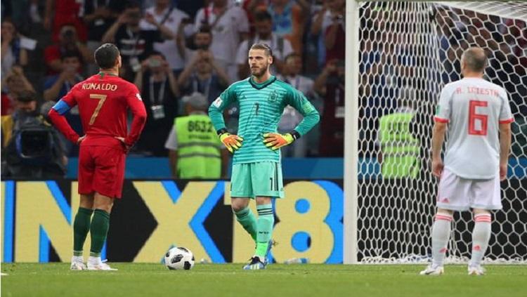 Ronaldo berhadapan dengan David De Gea. - INDOSPORT