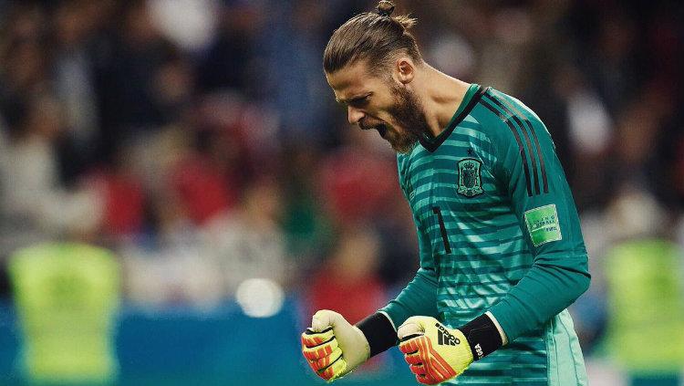 Kiper Spanyol David de Gea merayakan selebrasi kemenangan 1-0 atas Iran di Piala Dunia 2018. Copyright: INDOSPORT.com