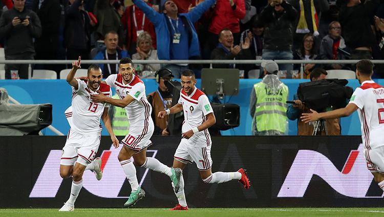 Para pemain Maroko merayakan gol yang dicetak ke gawang Spanyol. - INDOSPORT