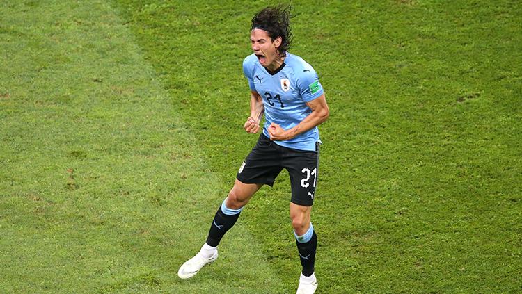 Edinson Cavani merayakan golnya ke gawang Portugal. Copyright: INDOSPORT