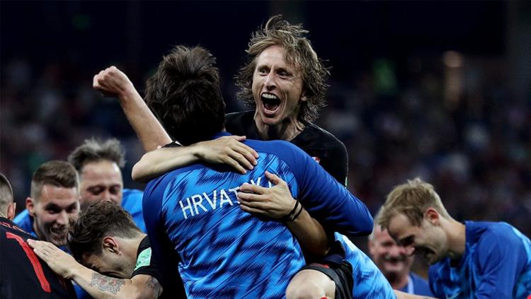 Luka Modric merayakan keberhasilan Kroasia yang lolos ke 8 besar Piala Dunia 2018.