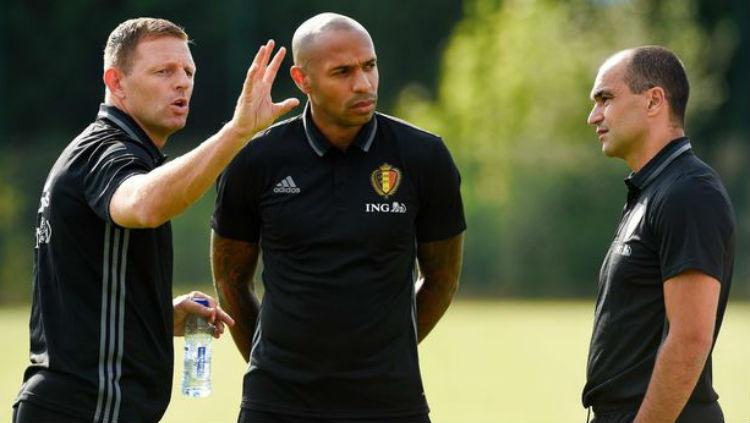 Asisten pelatih Belgia, Thierry Henry (tengah).