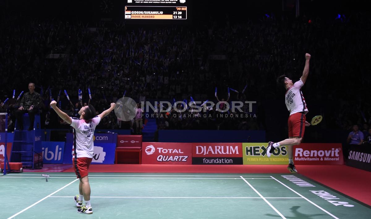 Aksi selebrasi Marcus Fernaldi Gideon/Kevin Sanjaya Sukamuljo menjadi juara Indonesia Open 2018.