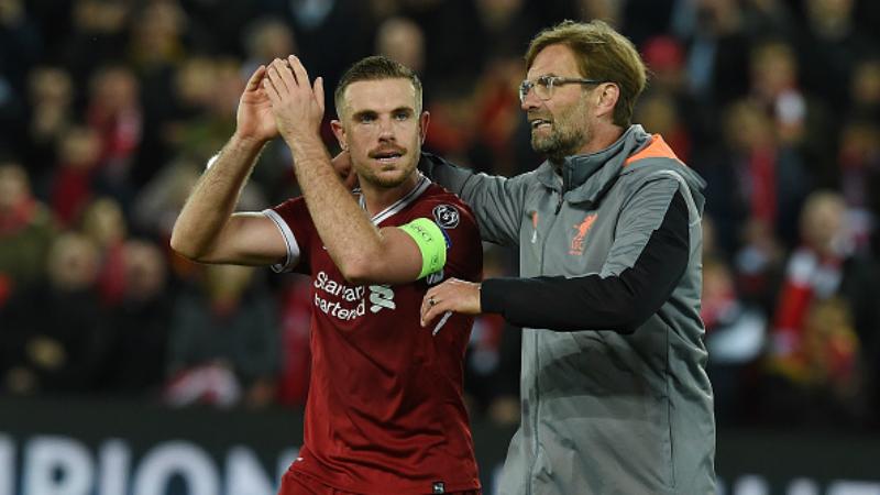 Kapten dan pelatih Liverpool, Jordan Henderson (kiri) dan Jurgen Klopp. - INDOSPORT