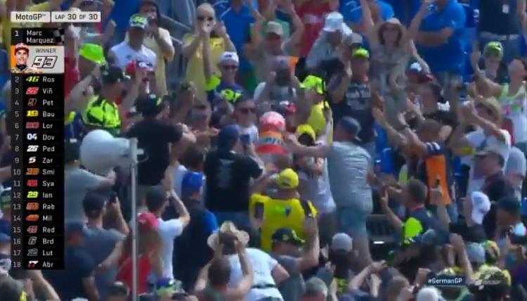 Marc Marquez selebrasi di tribun Fans Valentino Rossi. - INDOSPORT
