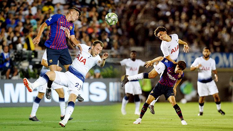 Duel udara pemain Barcelona vs Tottenham Hotspur.