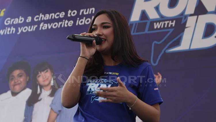 Marion Jola membawakan lagu di acara Run with Indonesia Idol 2018.
