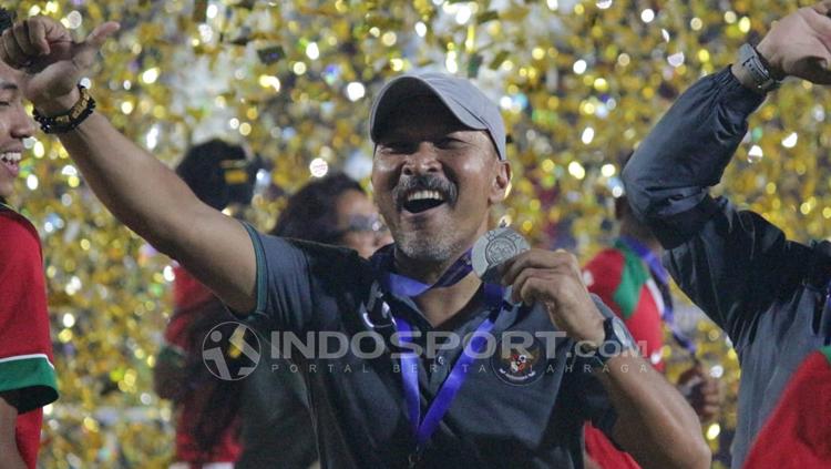 Selebrasi Fakhri Husaini setelah Indonesia menjuarai Piala AFF U-16. Copyright: INDOSPORT/Fitra Herdian