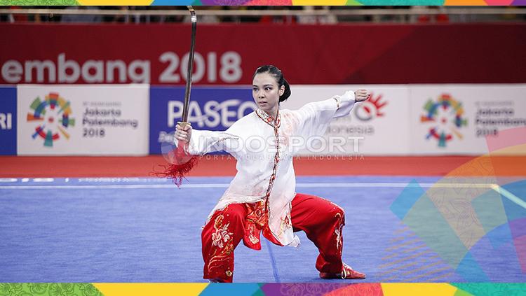 Atlet wushu Indonesia, Lindswell Kwok berhasil meraih medali emas Asian Games 2018. Copyright: INDOSPORT/Herry Ibrahim