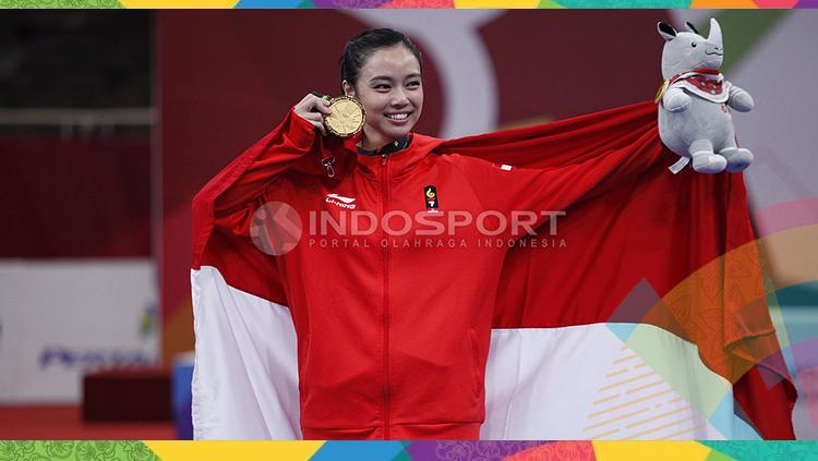 Atlet wushu Indonesia, Lindswell Kwok sabet medali emas Asian Games 2018. Copyright: INDOSPORT/Herry Ibrahim