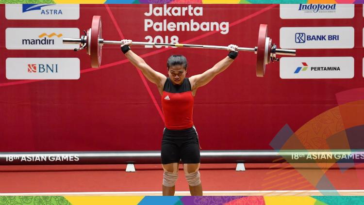 Sri Wahyuni, atlet angkat besi kebangaan Indonesia, resmi menjadi ibu. INASGOC/Fanny Octavianus/YU/18. - INDOSPORT