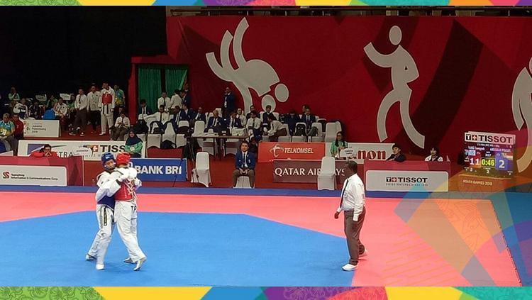 Anugrah Prasetyo Rizky saat melawan China di Asian Games 2018. Copyright: Annisa Hardjanti/INDOSPORT