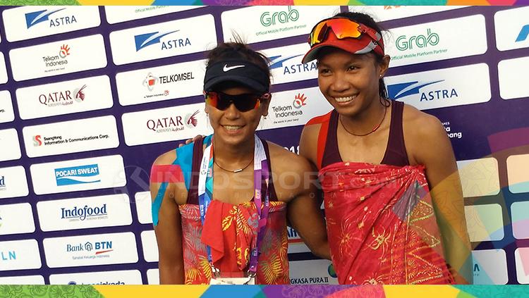 Dua tim putri voli pantai Indonesia, Dhita Juliana-Putu Dini Jasita Utami menang mudah dari lawannya.