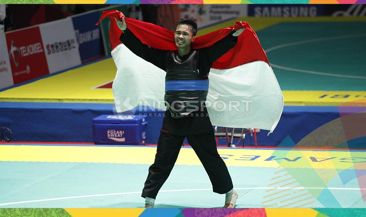 Selebrasi pesilat Indonesia, Abdul Malik usai memastikan juara dan medali emas.