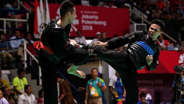 Atlet pencak silat Malaysia, Mohd Fauzi ketika melawan perwakilan Vietnam di final Asian Games 2018 - INDOSPORT