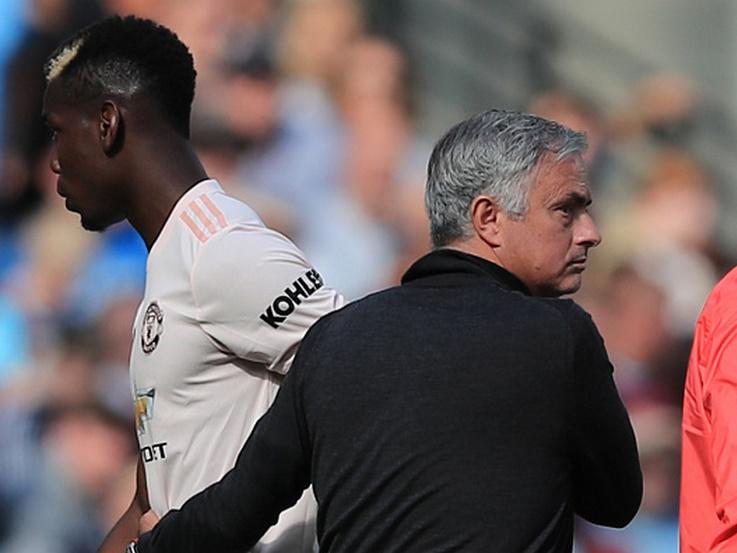 Paul Pogba dan Jose Mourinho Copyright: INDOSPORT