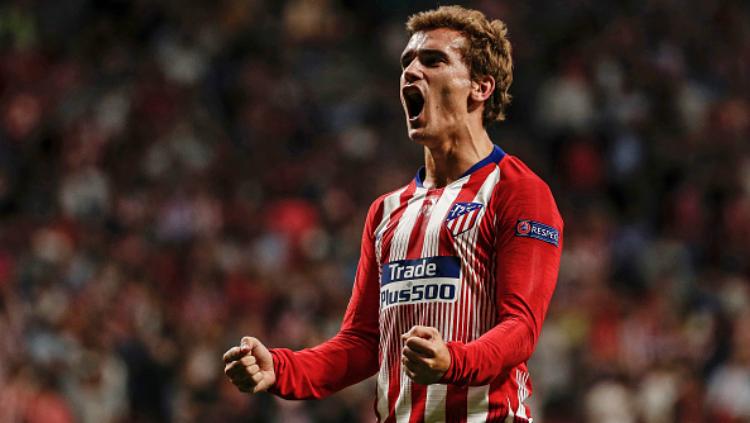 Antoine Griezmann selebrasi usai cetak gol bersejarah Liga Champions di laga Atletico Madrid vs Club Brugge. Copyright: INDOSPORT