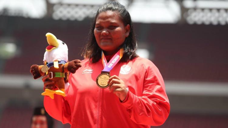 Suparniyati meraih medali emas kedua Indonesia di Asian Para Games 2018. - INDOSPORT