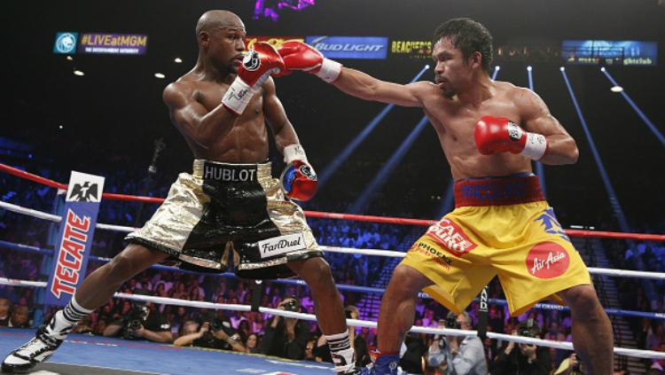 Duel tinju Floyd Mayweather vs Manny Pacquiao pada 2015 silam. Copyright: Getty Images