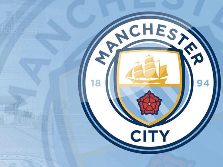 Logo Manchester City. Copyright: Suhaeli/INDOSPORT/ISTIMEWA