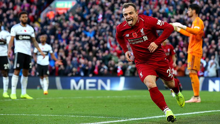 Selebrasi Xherdan Shaqiri saat mencetak gol kedua untuk Liverpool ke gawang Fulham. Copyright: Getty Images