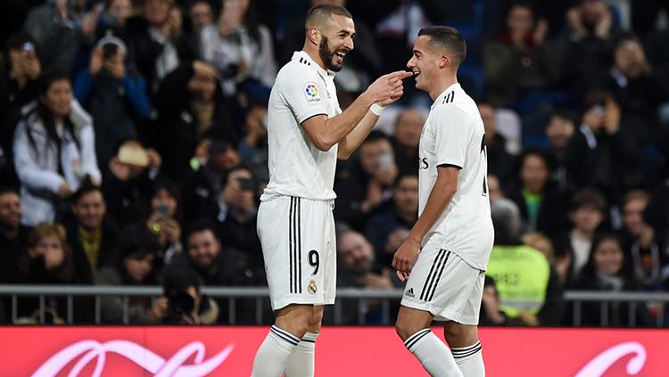 Lucas Vazquez dan Benzema merayakan gol pertama ke gawang Rayo Vallecano.