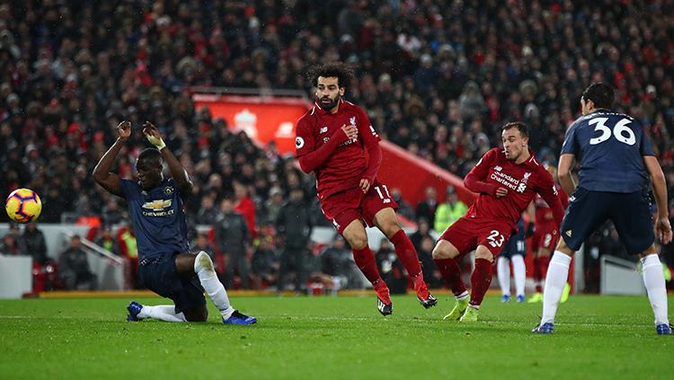 Shaqiri saat mencetak gol kedua utuk Liverpool di laga kontra Manchester United. Copyright: Indosport