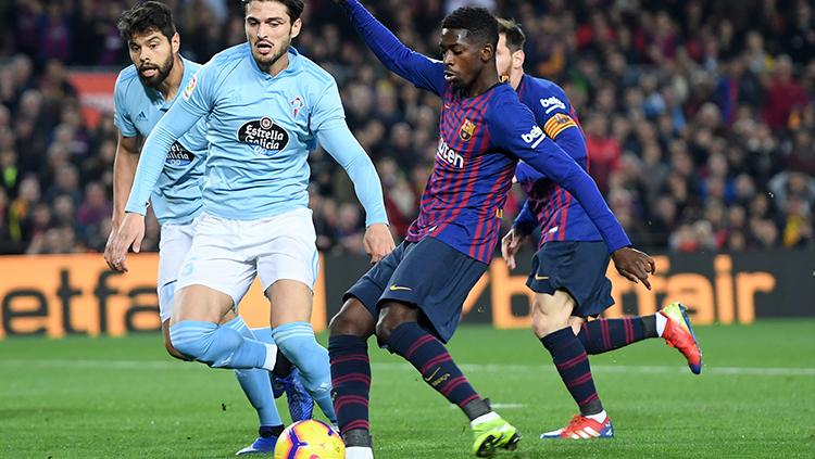 Dembele mencoba melakukan tembakan ke gawang Celta Vigo. Copyright: Alex Caparros/Getty Images