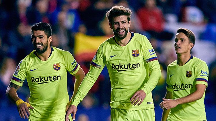 Denis Suarez (kanan) akan segera dijual dengan harga 'murah' oleh Barcelona. - INDOSPORT