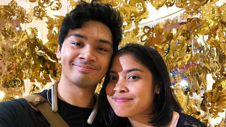 Mikha Angelo dan atlet bulutangkis tunggal putri Indonesia, Gregoria Mariska Tunjung.