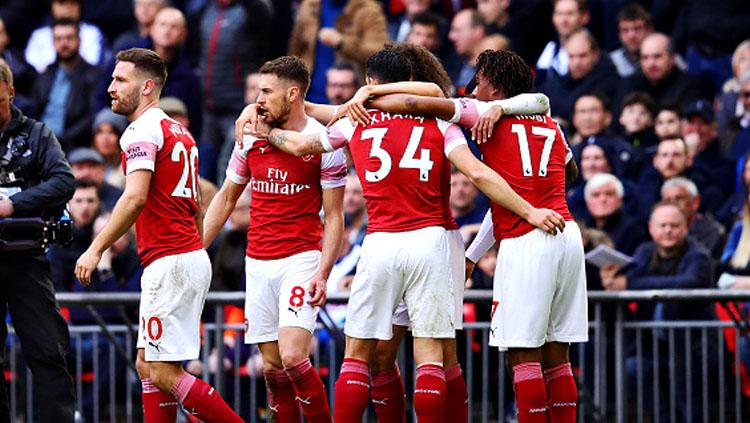 Selebrasi para pemain Arsenal merayakan gol dari Aaron Ramsey ke gawang Tottenham Hotspur.