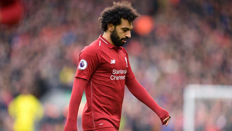 Ekspresi rasa kecewa dari pemain bintang Liverpool, Mohamed Salah. - INDOSPORT