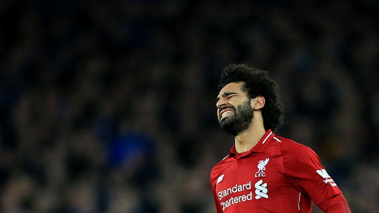 Ekspresi rasa kecewa dari pemain bintang Liverpool, Mohamed Salah. Copyright: INDOSPORT