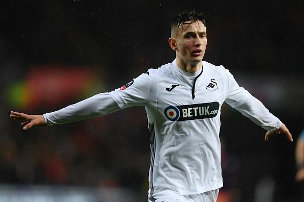 Pemain Swansea berselebrasi Copyright: INDOSPORT.COM