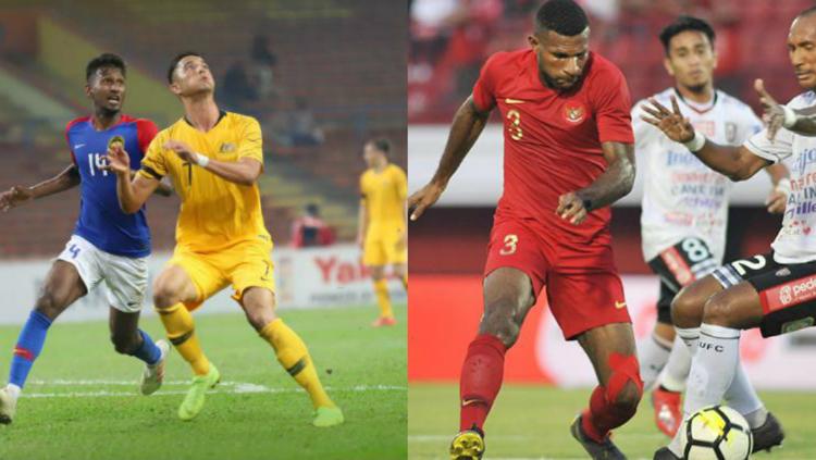 Pemain Timnas Malaysia dan Indonesia saat uji coba