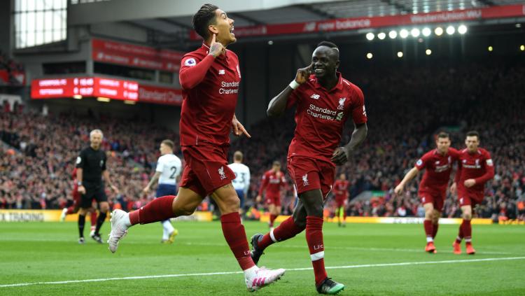 Roberto Firmino merayakan golnya di pertandingan Liverpool vs Tottenham Hotspur, Minggu (31/03/19) malam WIb. Copyright: Shaun Botterill/Getty Images