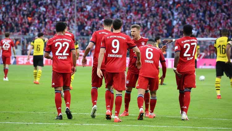 Momen para pemain merayakan gol pada pertandingan Bayern Munchen vs Borussia Dortmund di Bundesliga Jerman, Sabtu (06/04/19).