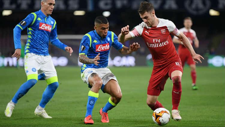 Aaron Ramsey saat membela Arsenal kala melawan Napoli di liga Europa