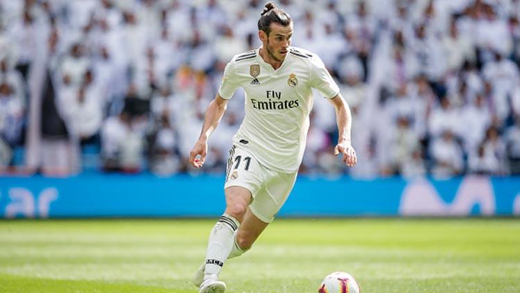 Pemain bintang Real Madrid, Gareth Bale saat sedang menggiring bola dalam pertandingan melawan Eibar pada tanggal 6 April 2019 lalu. Copyright: Soccrates/Getty Images
