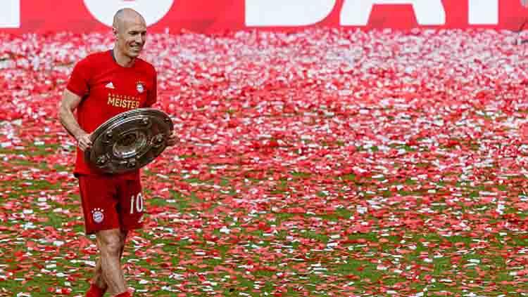 Akhir yang manis dari Arjen Robben saat menutup kariernya di Bayern Munchen pada musim 2018-19. Copyright: TF-Images/GettyImages