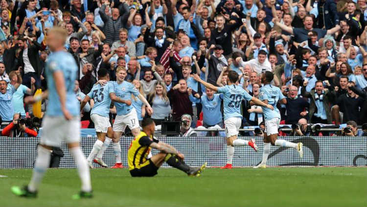 Selebrasi para pemain Manchester City. Copyright: Richard Heathcote/Getty Images