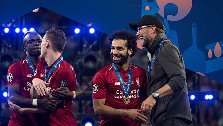 Juergen Klopp dan Mohamed Salah tampak semringah keluar sebagai juara Liga Champions di stadion Wanda Metropolitano. TF-Images/Getty Images