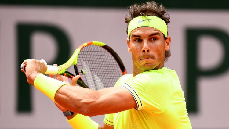 Rafael Nadal sukses menumbangkan Roger Federer di semifinal Prancis Terbuka 2019, Jumat (07/06/19). - INDOSPORT