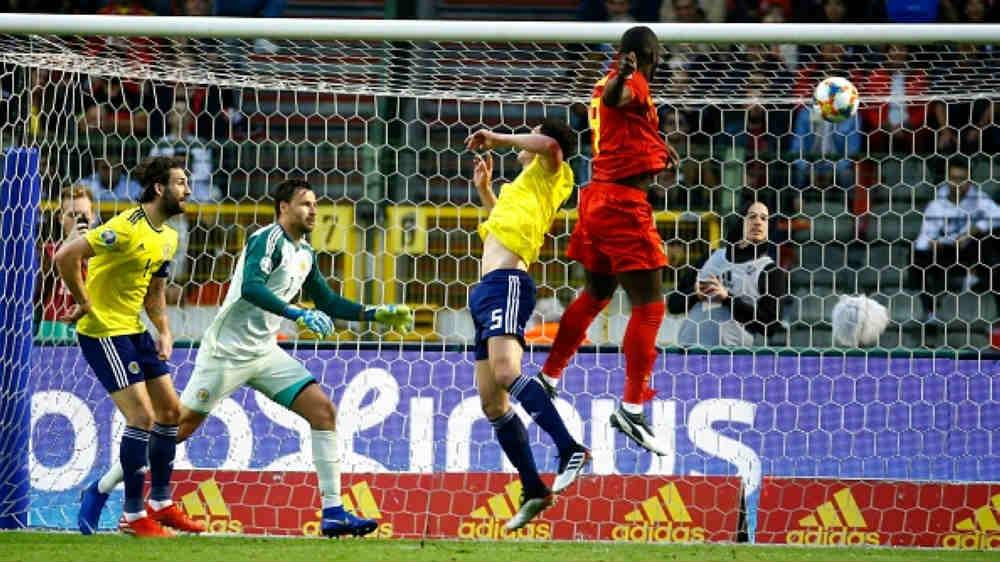 Proses gol pertama Lukaku di laga Belgia vs Skotlandia, Jimmy Bolcina / Photonews via Getty Images